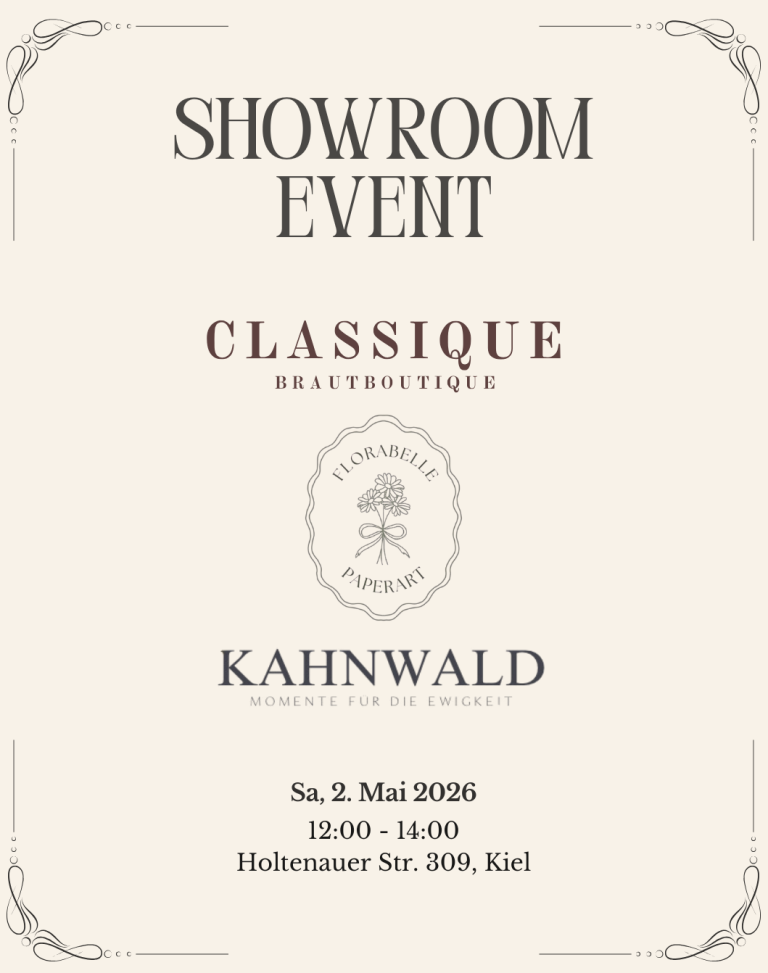 Brautkleid wird von hinten gezeigt vor einem schwarzen Hintergrund. Das Kleid hat Puffärmel aus hochwertigem Organza.